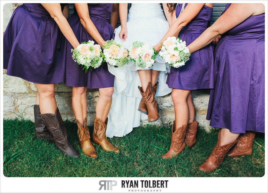 bride and bridesmaids with boots and bouquets
